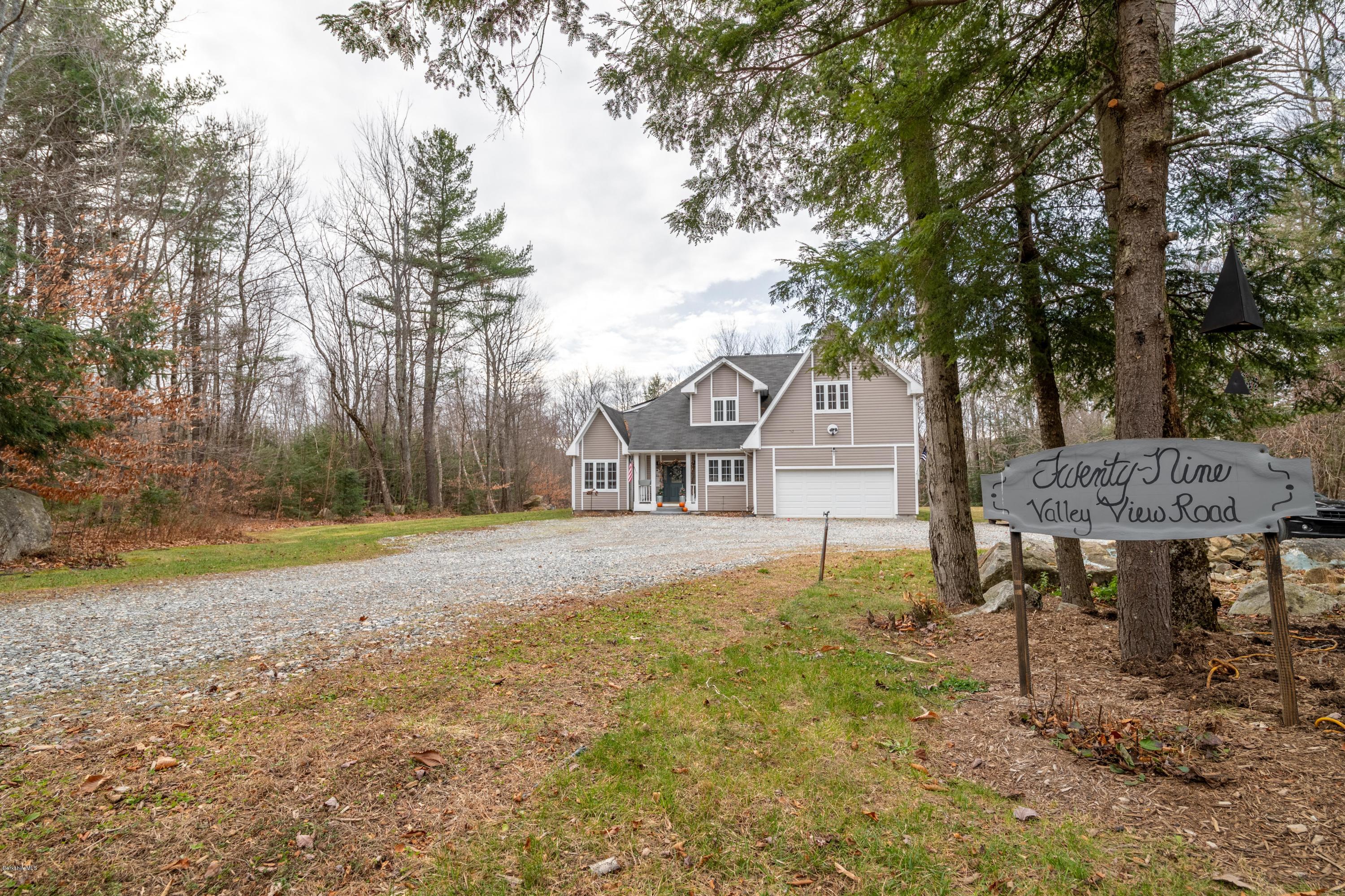 29 Valley View Road Becket, MA 01223 - Photo 36 of 36 a house view with a sitting space and garden space