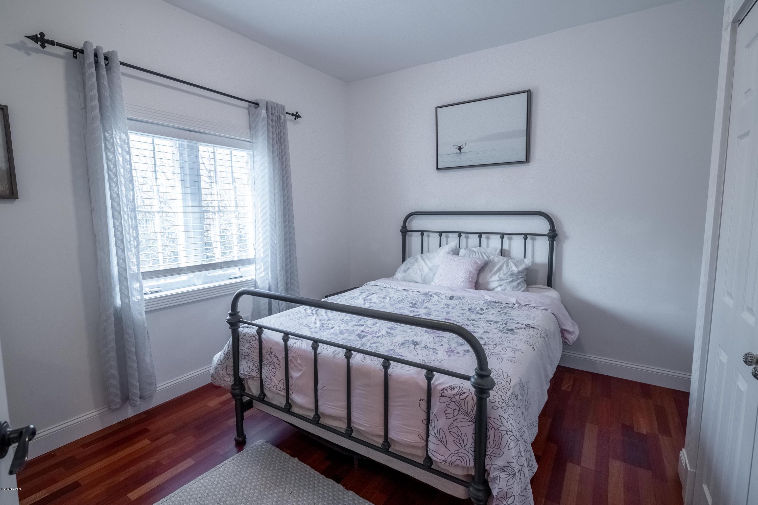 29 Valley View Road Becket, MA 01223 - Photo 6 of 36 a bedroom with a bed and a window