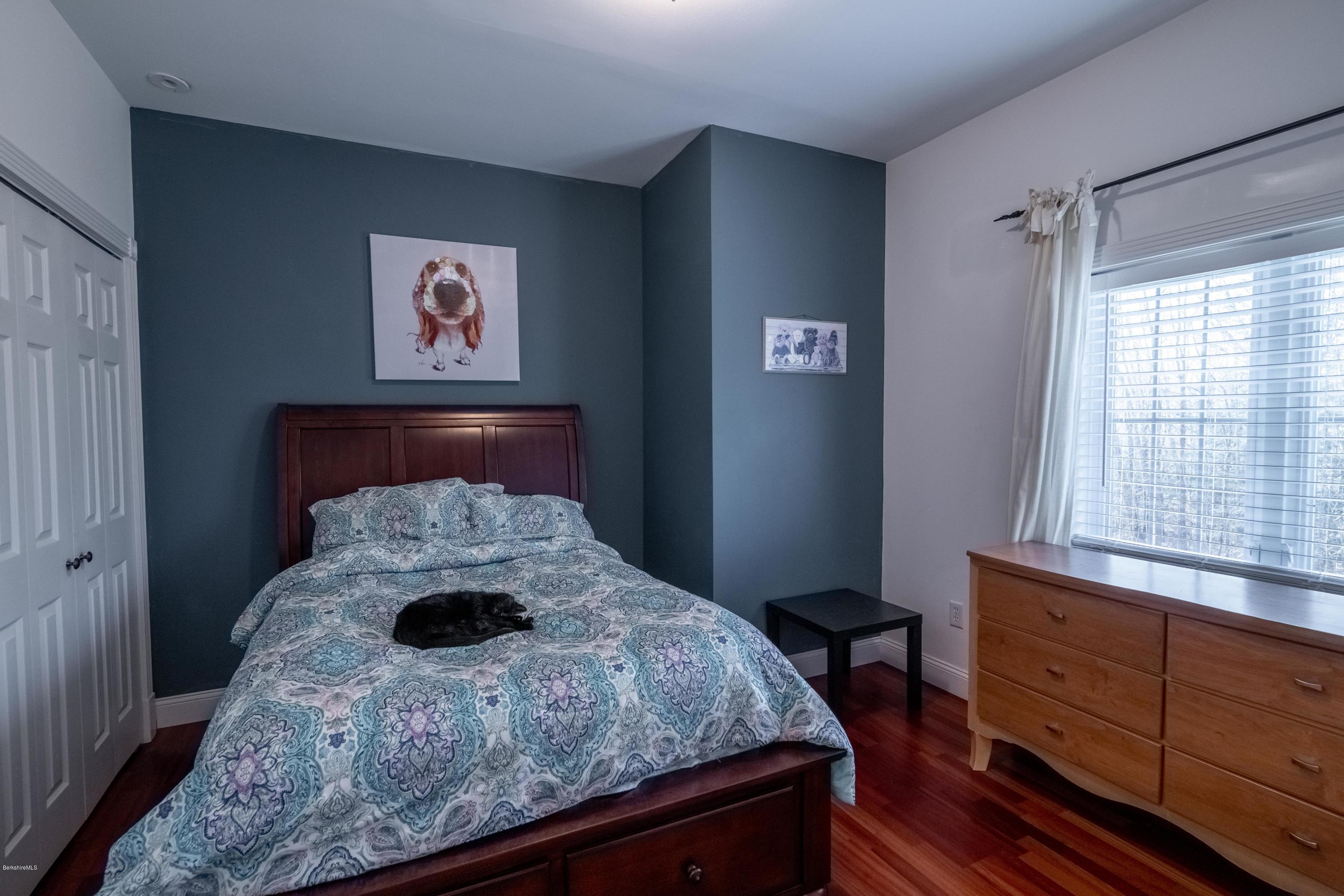 29 Valley View Road Becket, MA 01223 - Photo 7 of 36 a bedroom with a bed and a window