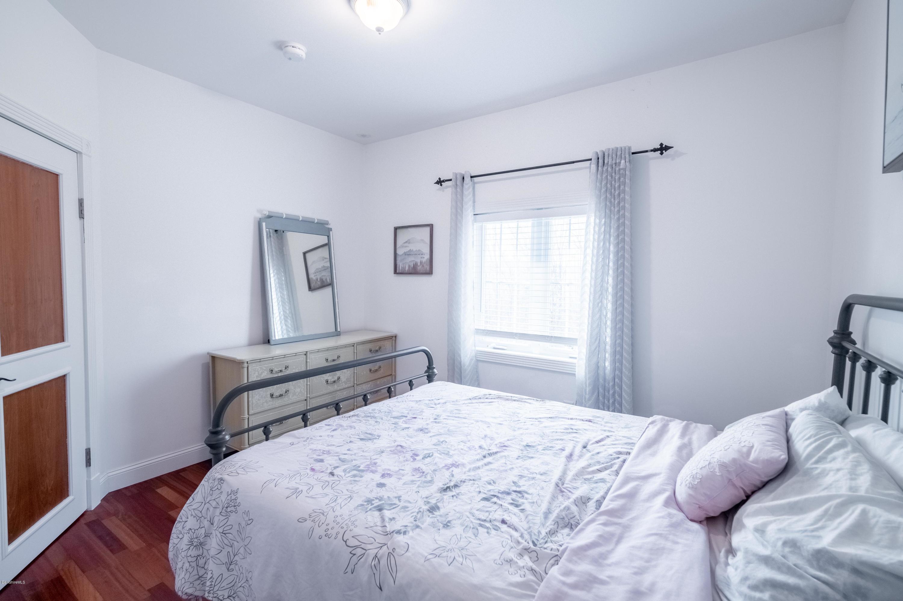 29 Valley View Road Becket, MA 01223 - Photo 9 of 36 a bedroom with a bed and a window
