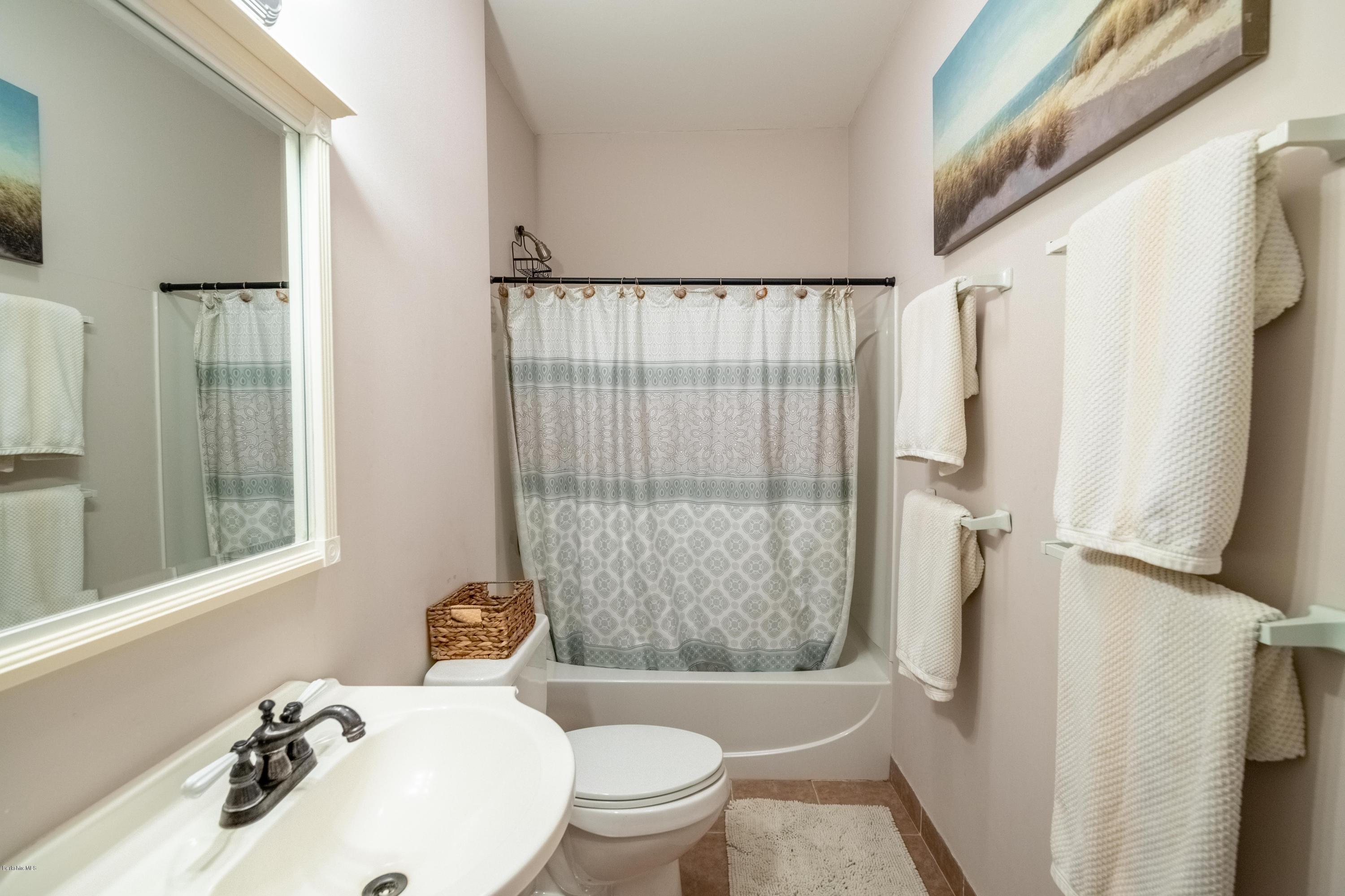 29 Valley View Road Becket, MA 01223 - Photo 10 of 36 a bathroom with a sink toilet and shower