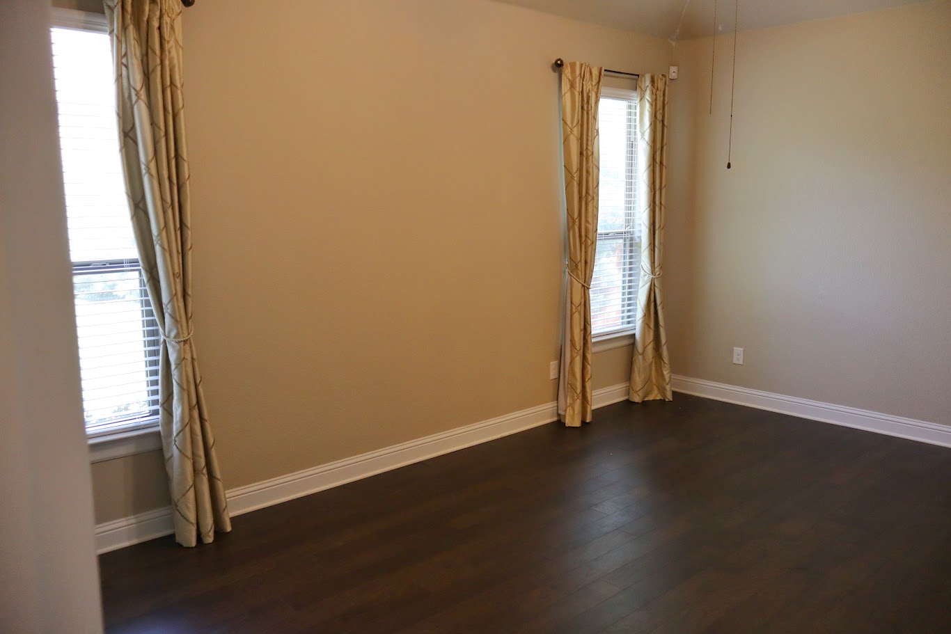 1509 Highland Ridge Road Georgetown, TX 78628 - Photo 15 of 28 Rich hardwood flooring complements the naturally illuminated walls of this versatile room, featuring elegant window treatments.