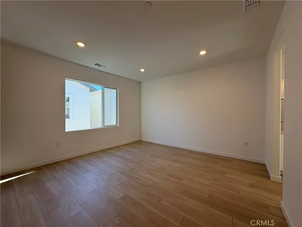 a view of a room with shelf on the wall