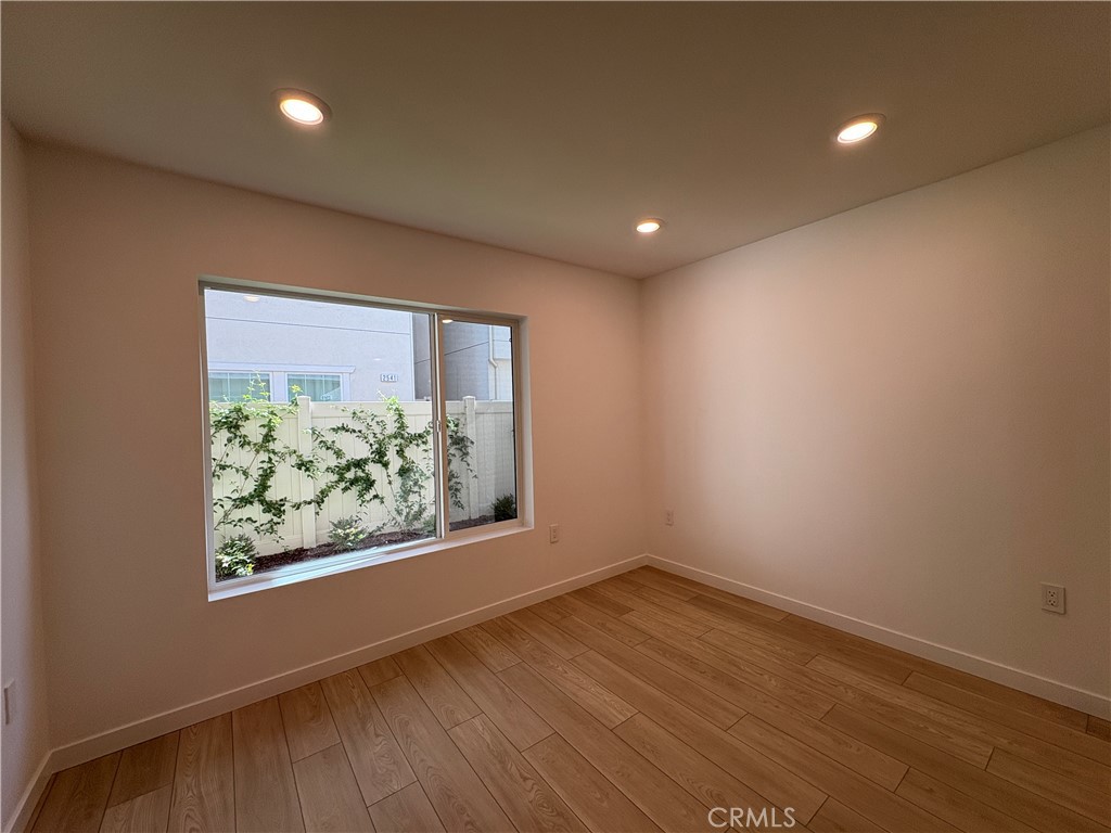 2540 Everly Street El Monte, CA 91733 - Photo 2 of 28 an empty room with wooden floor and window