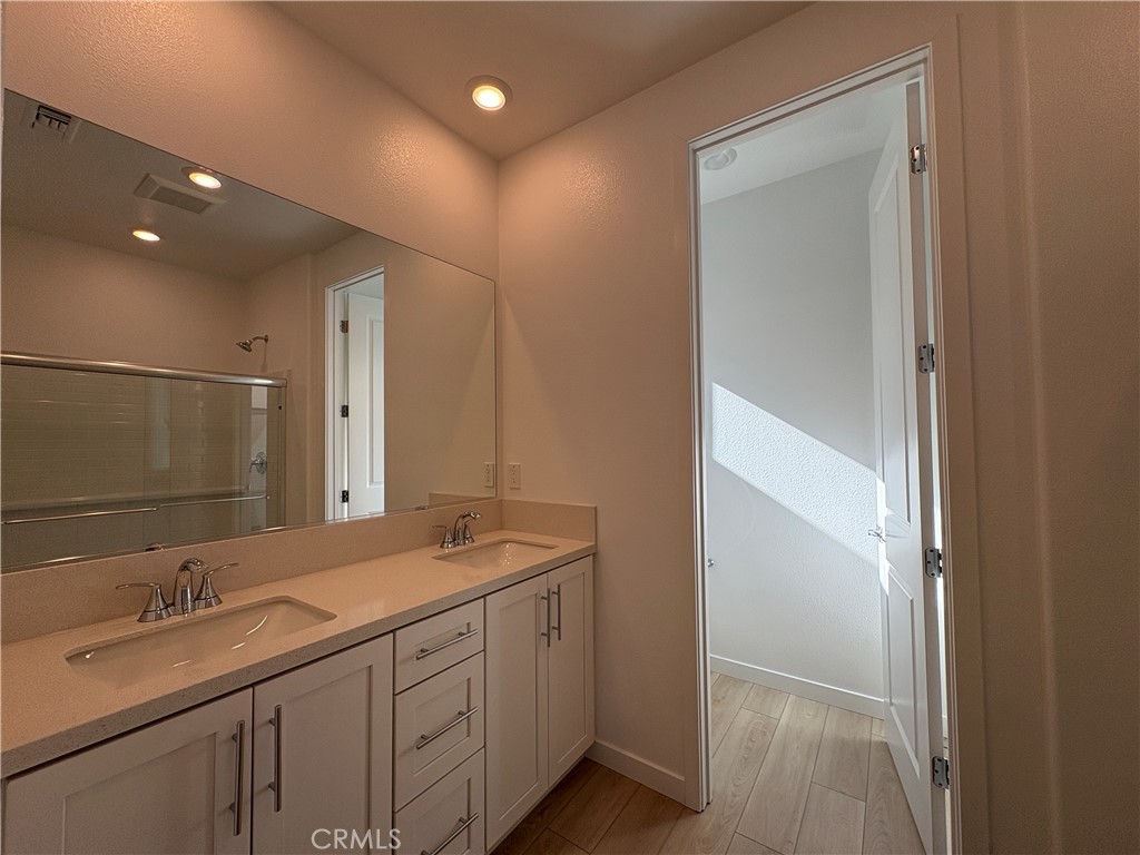 2540 Everly Street El Monte, CA 91733 - Photo 23 of 28 a bathroom with a double vanity sink and mirror