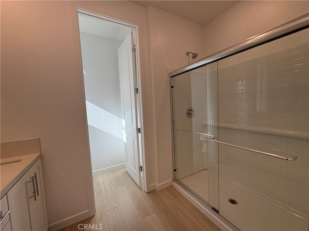 2540 Everly Street El Monte, CA 91733 - Photo 24 of 28 a bathroom with a glass shower door