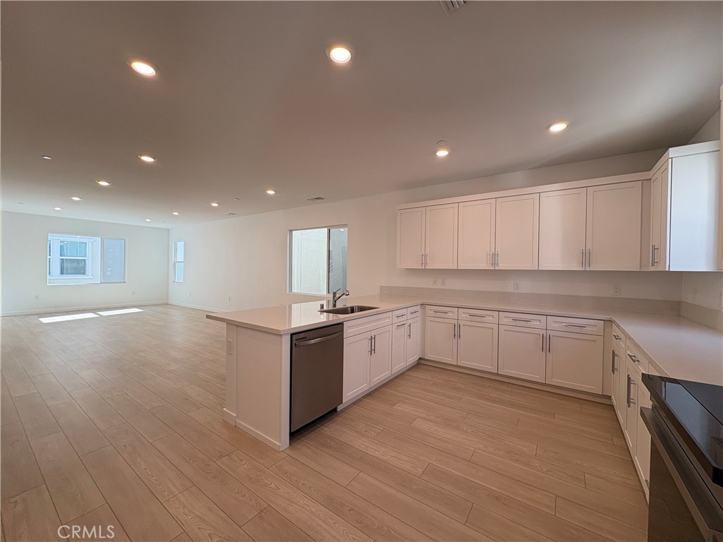 2540 Everly Street El Monte, CA 91733 - Photo 9 of 28 a large kitchen with granite countertop a large counter top and stainless steel appliances