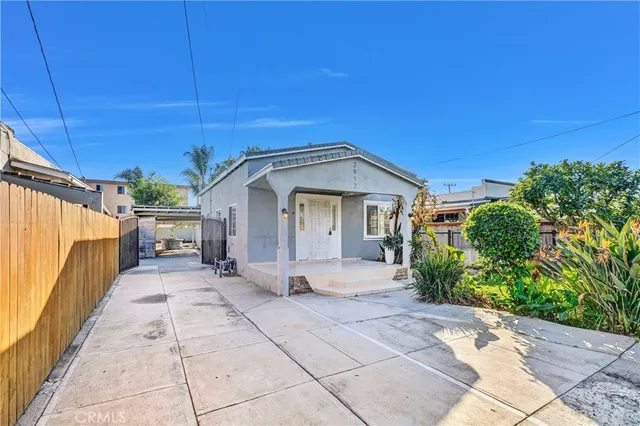 a view of a house with a tree