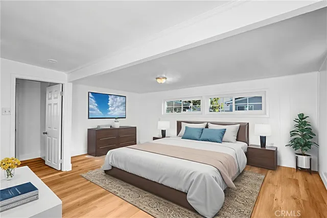 a bedroom with a large bed and a couch