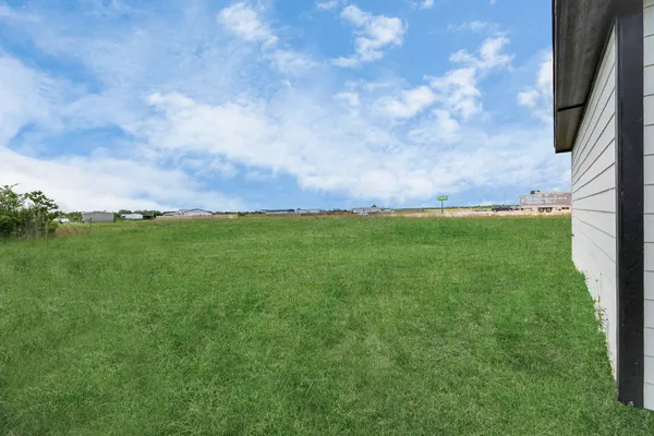 a view of a field with an outdoor space