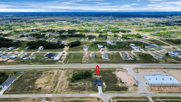 a view of a swimming pool with a yard