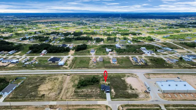 a view of a swimming pool with a yard