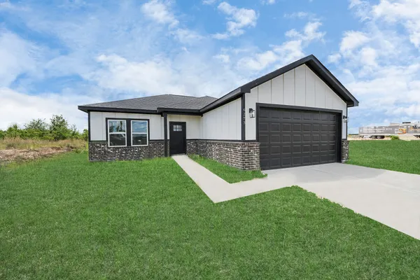 a view of a lake with houses in back