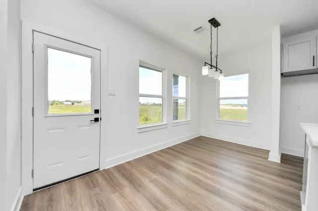 a view of an empty room with a window