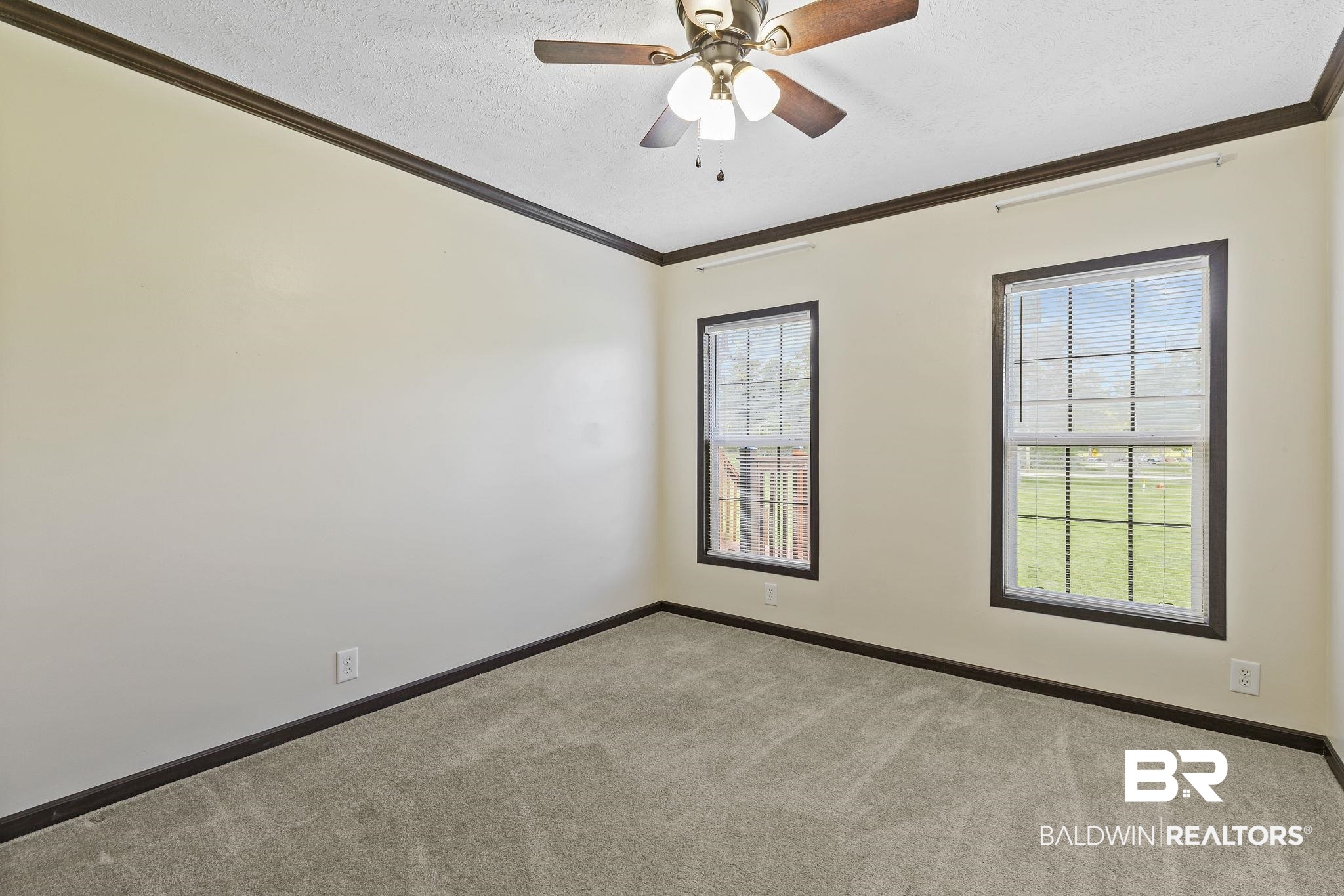 35641 County Road 39 Stapleton, AL 36578 - Photo 28 of 46 Empty room with ceiling fan, light colored carpet, plenty of natural light, and a textured ceiling