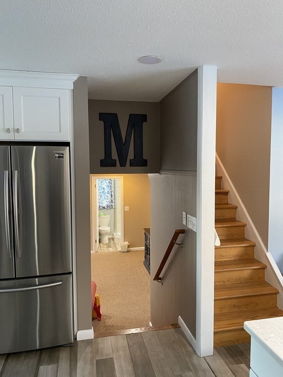 30 Hampton Knolls Road Holyoke, MA 01040 - Photo 11 of 38 a view of a hallway with wooden floor and staircase