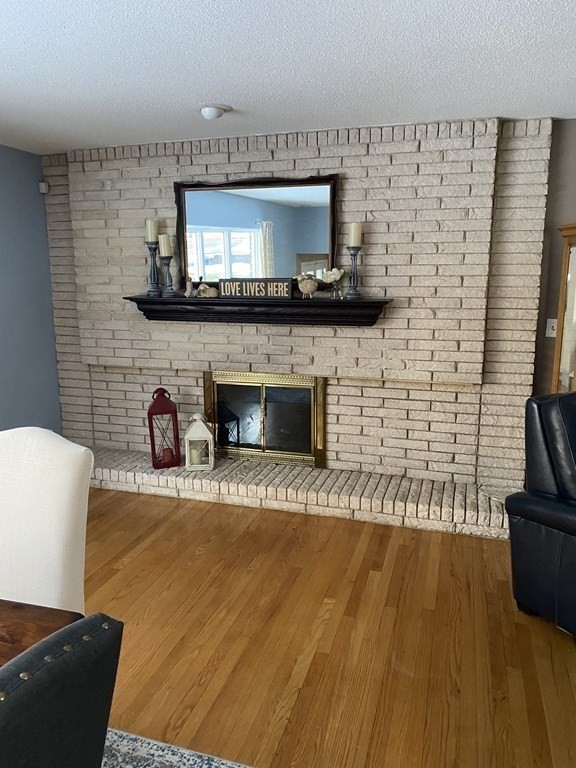 30 Hampton Knolls Road Holyoke, MA 01040 - Photo 15 of 38 a living room with a flat screen tv and a fireplace