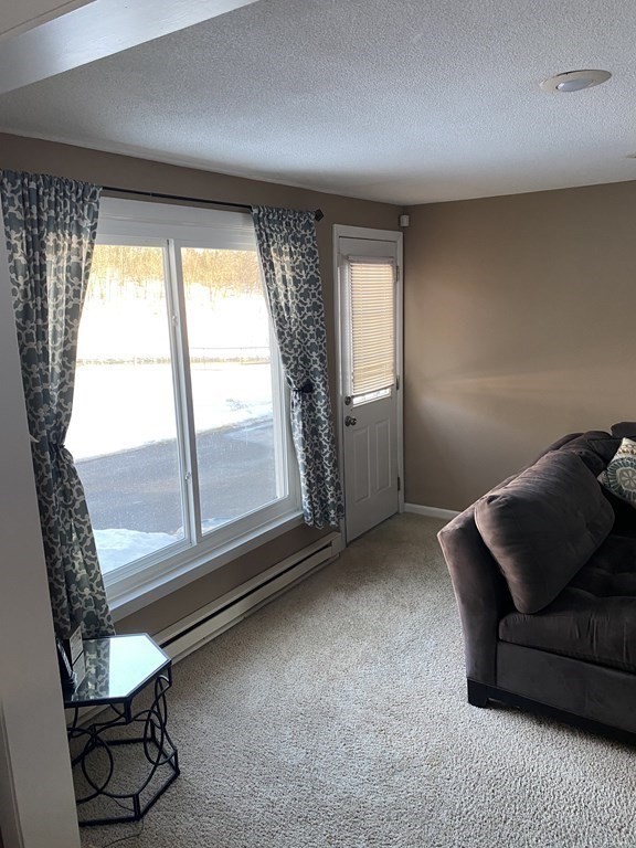 30 Hampton Knolls Road Holyoke, MA 01040 - Photo 23 of 38 a living room with furniture and a large window