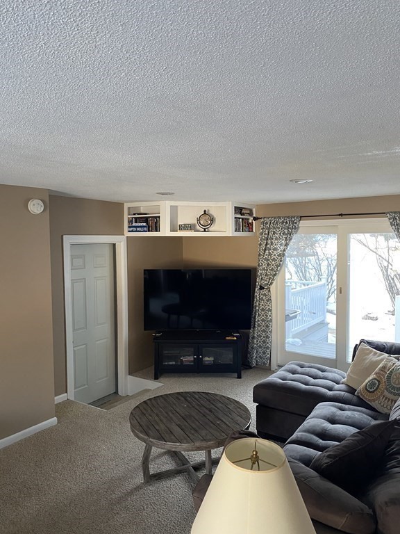 30 Hampton Knolls Road Holyoke, MA 01040 - Photo 24 of 38 a living room with furniture and a fireplace