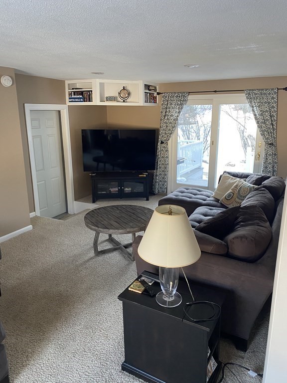 30 Hampton Knolls Road Holyoke, MA 01040 - Photo 25 of 38 a living room with furniture a window and a fireplace