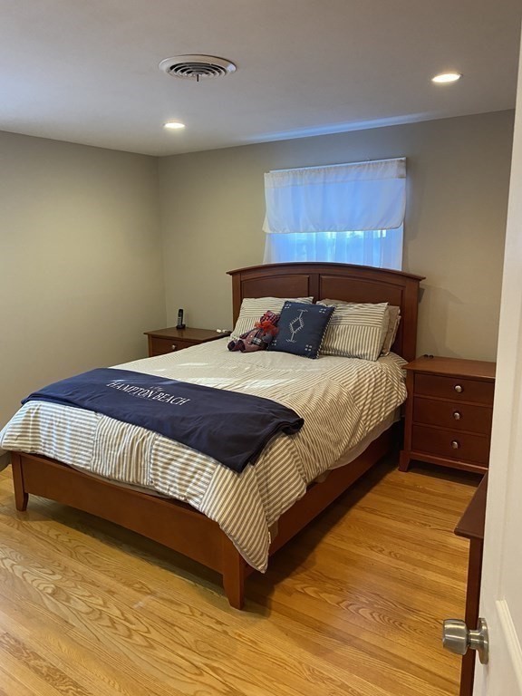 30 Hampton Knolls Road Holyoke, MA 01040 - Photo 26 of 38 a bedroom with a bed and wooden floor