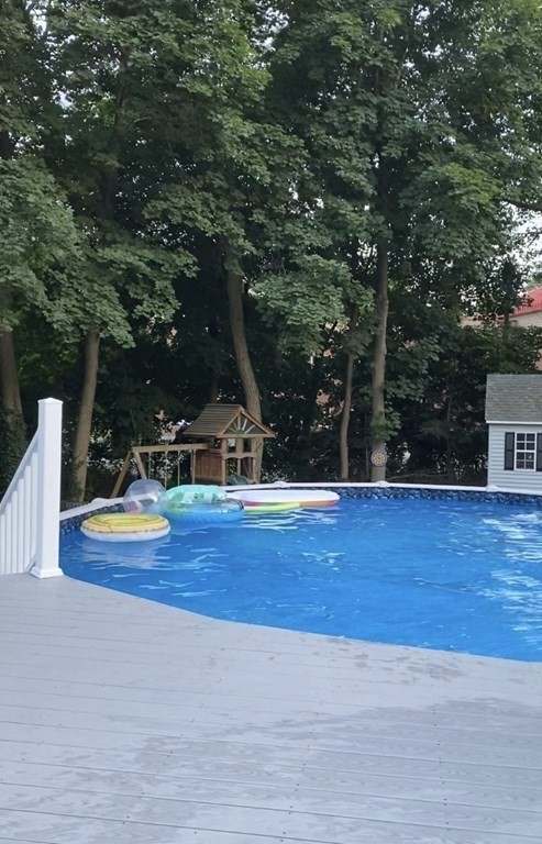 30 Hampton Knolls Road Holyoke, MA 01040 - Photo 32 of 38 a view of a swimming pool with an outdoor space and seating area