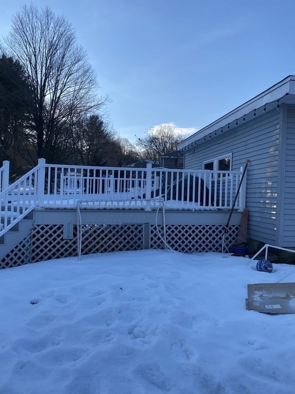 30 Hampton Knolls Road Holyoke, MA 01040 - Photo 37 of 38 a view of a deck with a bench and wooden fence