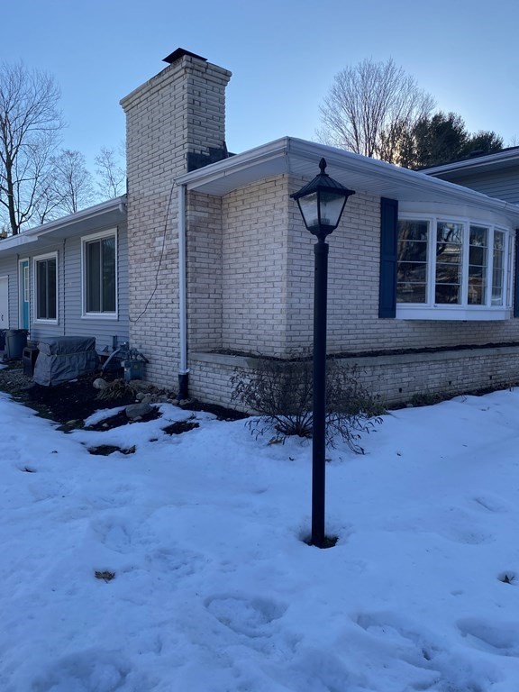 30 Hampton Knolls Road Holyoke, MA 01040 - Photo 4 of 38 a backyard of a house with wooden fence and a table
