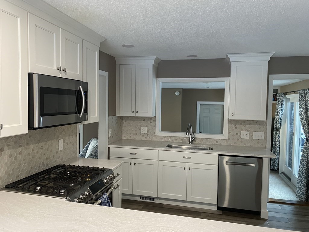 30 Hampton Knolls Road Holyoke, MA 01040 - Photo 7 of 38 a kitchen with a sink stove and microwave
