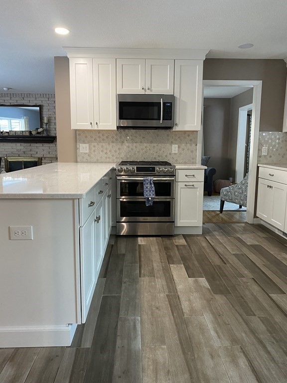 30 Hampton Knolls Road Holyoke, MA 01040 - Photo 8 of 38 a kitchen with a stove and a microwave