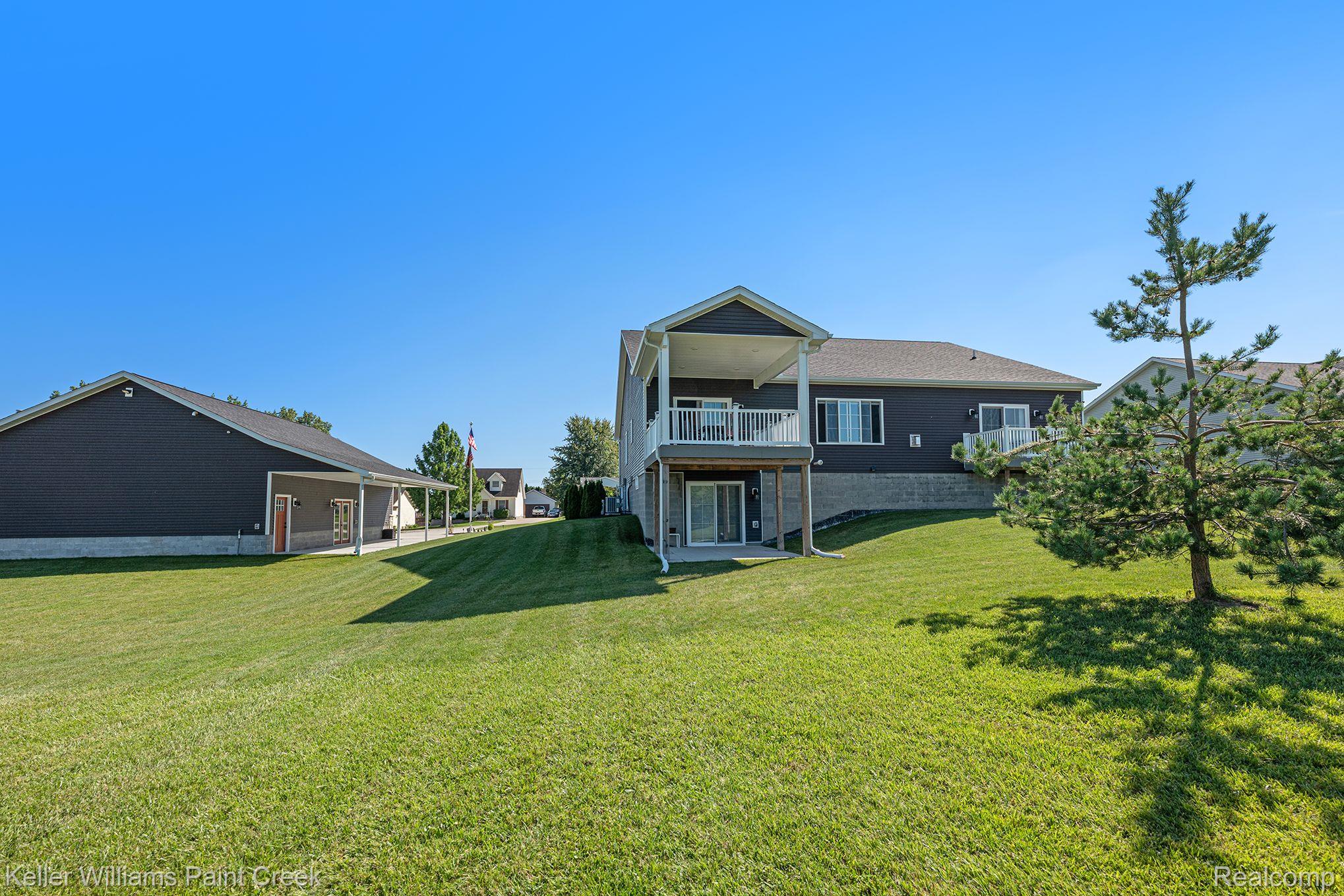 4098 Neuman Road St. Clair, MI 48079 - Photo 36 of 58 Bed Rm & Kitchen Balcony & Barn, Basement patio