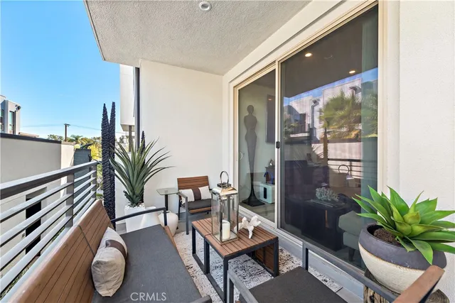 a bedroom with a large bed and a flat screen tv