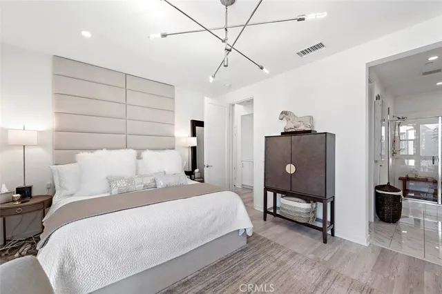 a spacious bathroom with a granite countertop sink a mirror and a shower