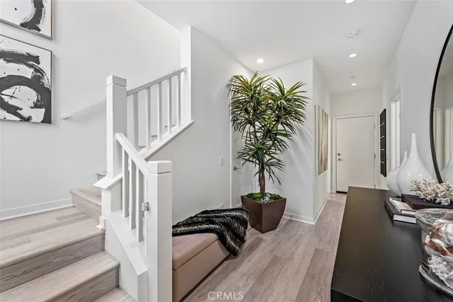 a view of a house with potted plants