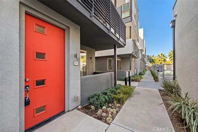 a view of a patio with couches table and chairs with garden view