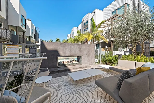 a view of swimming pool with outdoor seating and plants