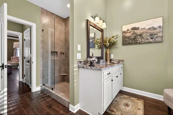a bathroom with a double vanity sink and a mirror