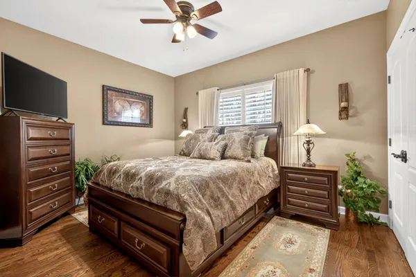 a bed room with a bed and a television