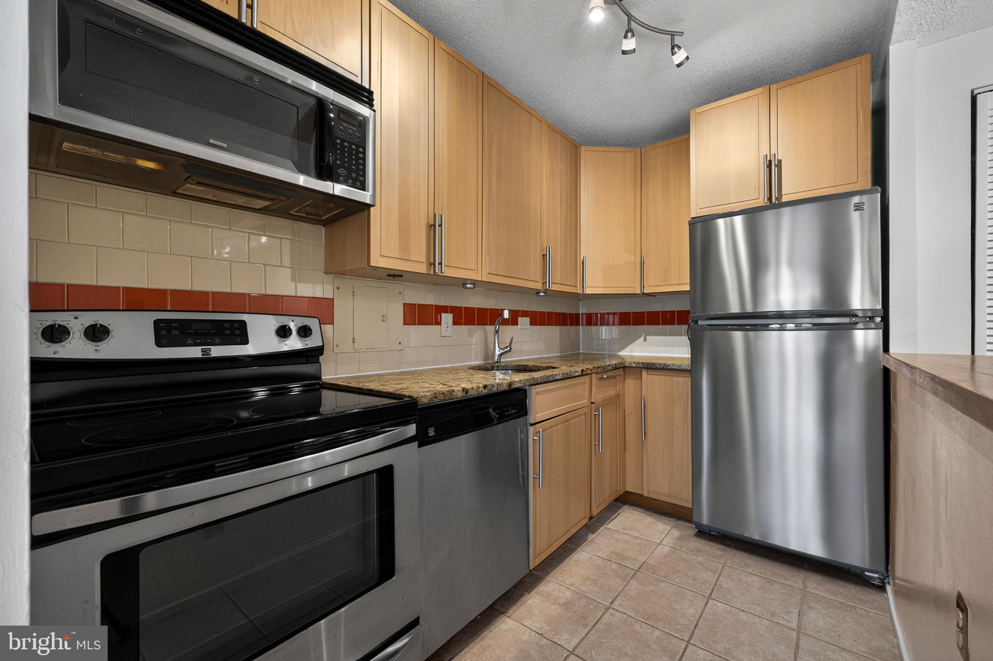 1311 Delaware Avenue Southwest Washington, DC 20024 - Photo 19 of 64 a kitchen with a refrigerator stove and microwave