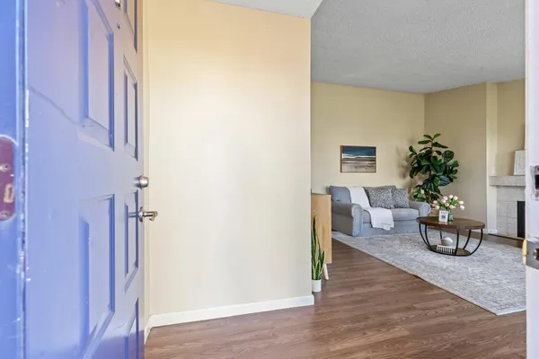 a view of a livingroom with furniture and front door