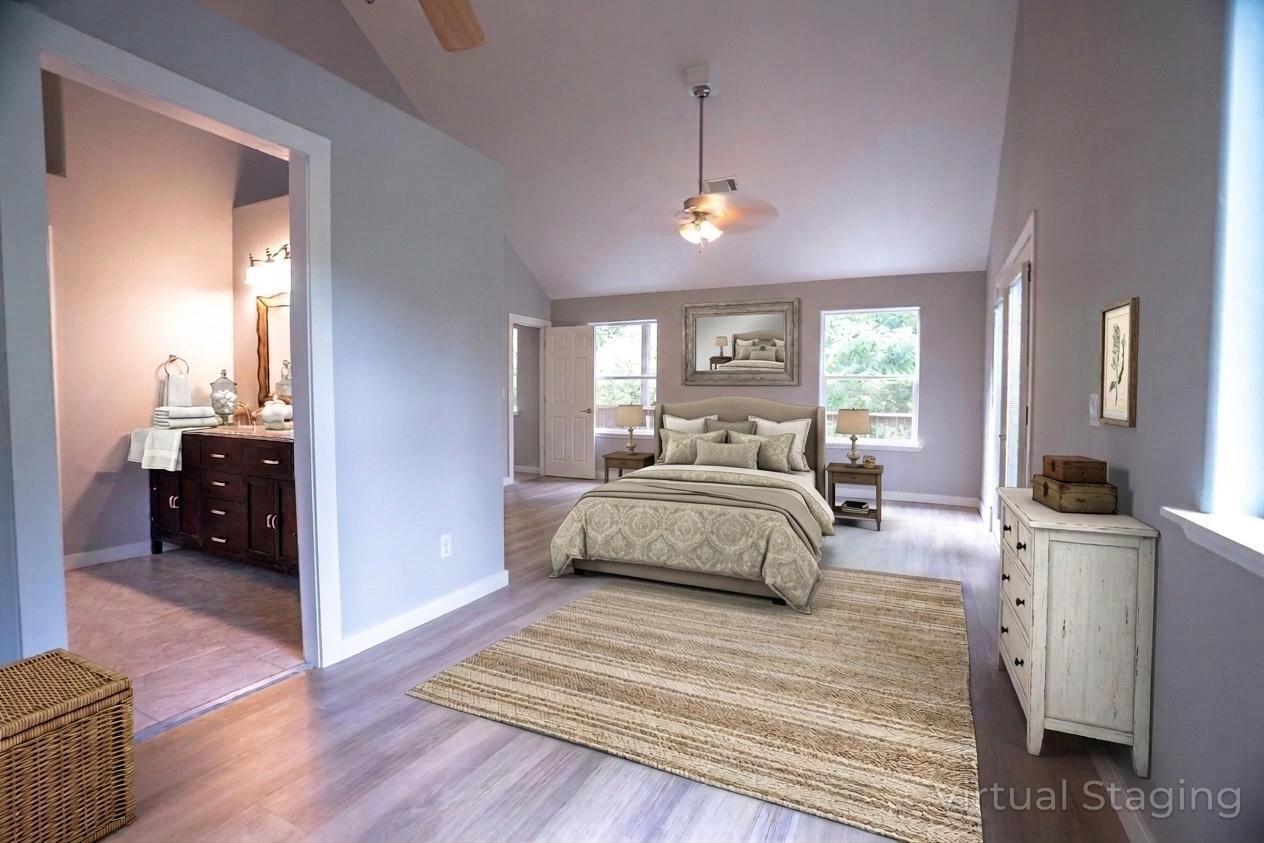 709 Pinewood Way Cave Junction, OR 97523 - Photo 12 of 24 a bedroom with a bed and a large mirror on the dresser