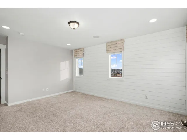 a bathroom with a granite countertop sink mirror and double