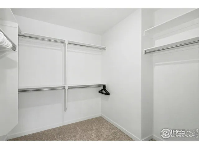 a view of washer and dryer with kitchen in the background