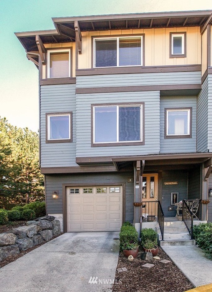2115 201st Place Southeast, Unit F1 Bothell, WA 98012 - Photo 1 of 10 a front view of a building