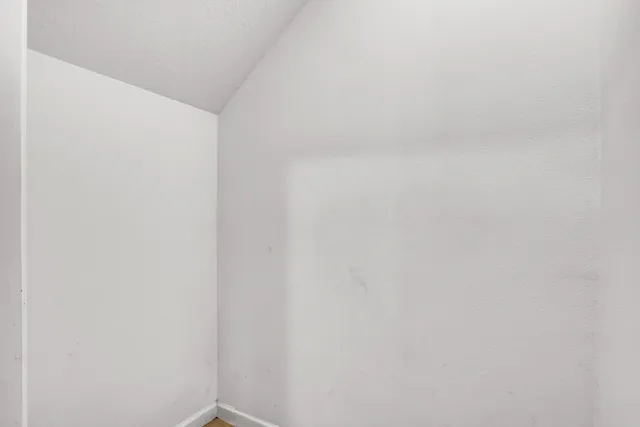 a living room with furniture a rug and a window