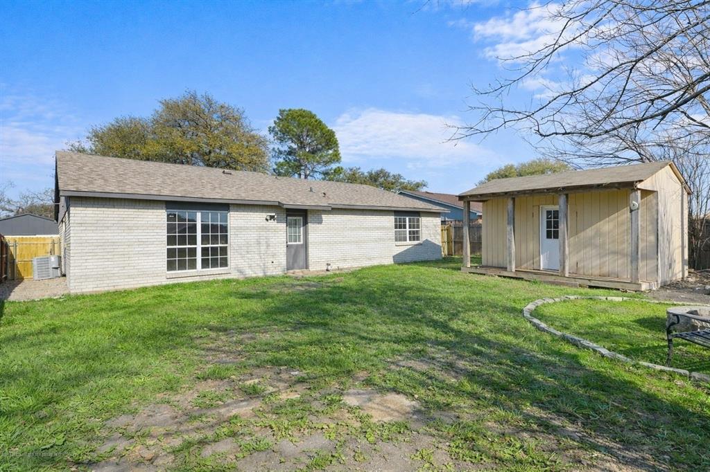 5516 Maple Lane Rowlett, TX 75089 - Photo 18 of 18 a view of a house with a backyard