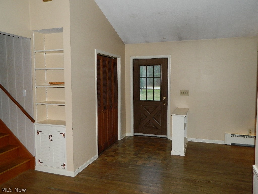 9284 Mayfield Road Chesterland, OH 44026 - Photo 3 of 33 Foyer Entrance with Large Guest Closet and Small Built In Decorative Bookcase Separating Foyer and Living Room