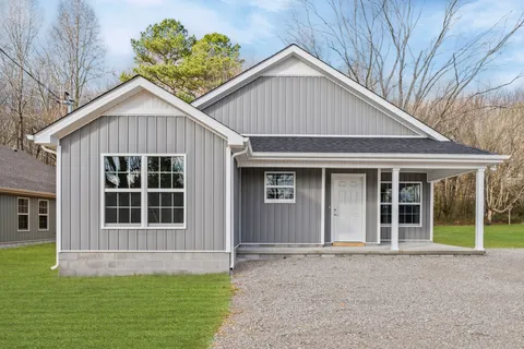 a view of front of house with a yard