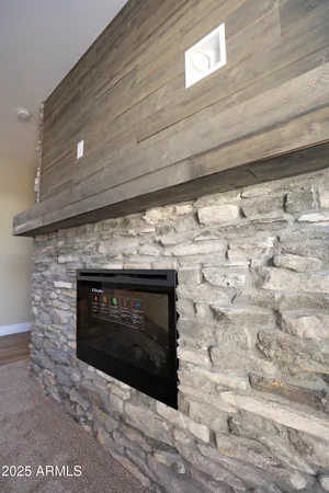 a fireplace with a clock on wall