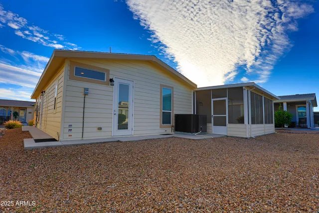 an aerial view of a house with a ocean view